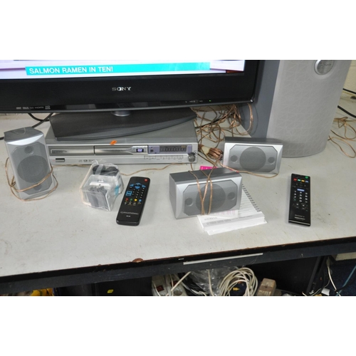 1062 - A SONY KDL 32S2030  32ins TV with remote and a Grundig Surround Sound DVD player with sub and three ... 