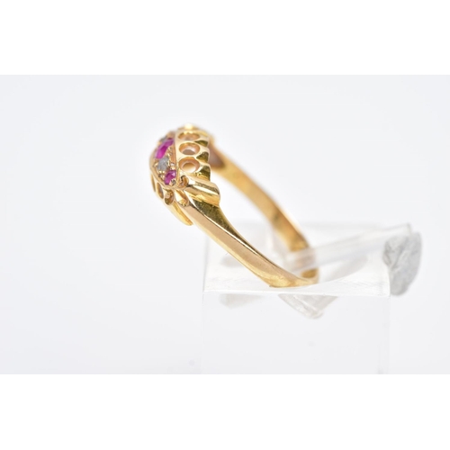 13 - AN EARLY 20TH CENTURY 18CT GOLD BOAT RING, designed with three graduated, circular cut rubies inters... 