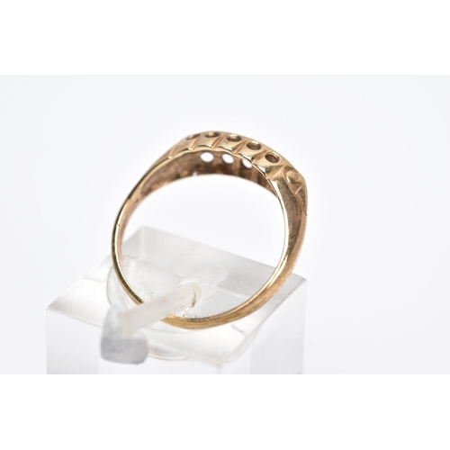 14 - A 9CT GOLD FIVE STONE BOAT RING, designed with a central single cut diamond interspaced with circula... 