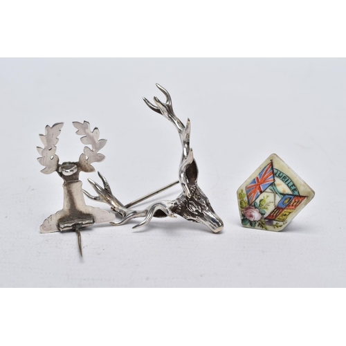 2 - TWO WHITE METAL BROOCHES AND A JUBILEE PLAQUE, the first brooch in the form of a stag head, realisti... 