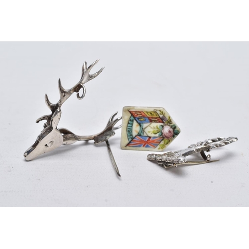 2 - TWO WHITE METAL BROOCHES AND A JUBILEE PLAQUE, the first brooch in the form of a stag head, realisti... 