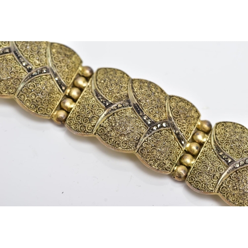 20 - A SILVER GILT MARCASITE WIDE LINK BRACELET, designed with six wavy edge textured links, set with mar... 