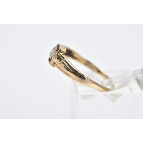 22 - A YELLOW METAL SINGLE STONE RING, designed with a central collet mounted circular cut colourless sto... 