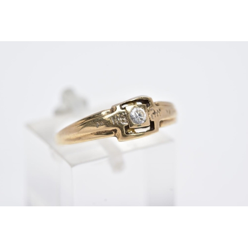 22 - A YELLOW METAL SINGLE STONE RING, designed with a central collet mounted circular cut colourless sto... 