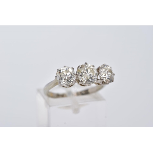 26 - A LATE VICTORIAN TO EARLY TWENTIETH CENTURY THREE STONE DIAMOND RING, centre old cushion diamond est... 