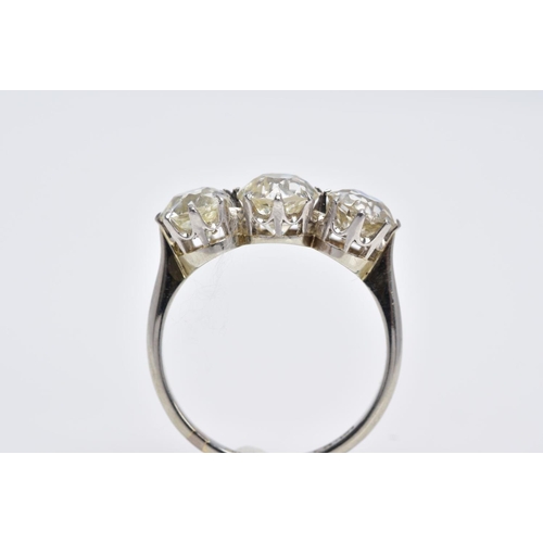 26 - A LATE VICTORIAN TO EARLY TWENTIETH CENTURY THREE STONE DIAMOND RING, centre old cushion diamond est... 