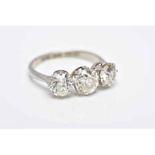 26 - A LATE VICTORIAN TO EARLY TWENTIETH CENTURY THREE STONE DIAMOND RING, centre old cushion diamond est... 