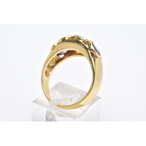 42 - A YELLOW METAL RING, a wide band set with eight various cut coloured stones, assessed as orange sapp... 