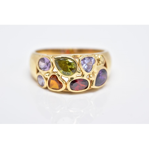 42 - A YELLOW METAL RING, a wide band set with eight various cut coloured stones, assessed as orange sapp... 