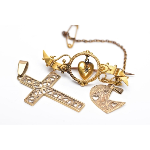 50 - A 9CT GOLD CROSS PENDANT AND A YELLOW METAL BROOCH AND PENDANT, the cross pendant with an openwork s... 