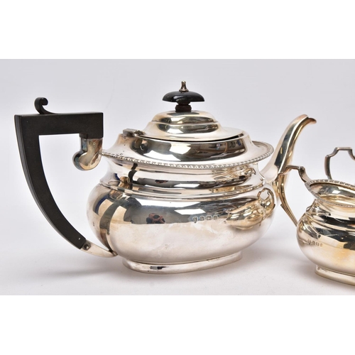 53 - A THREE PIECE SILVER TEA SET AND TWO GLASS VINIAGRETTES, the tea service set comprising a tea pot fi... 