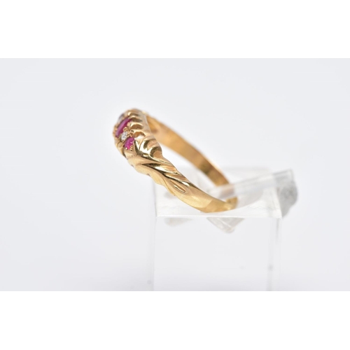 9 - AN EARLY 20TH CENTURY 18CT GOLD BOAT RING, designed with a central oval cut ruby interspaced with si... 