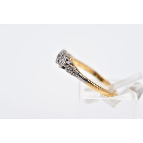 10 - A YELLOW METAL THREE STONE DIAMOND RING, designed with three illusion set diamonds, two old cut and ... 