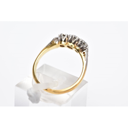 10 - A YELLOW METAL THREE STONE DIAMOND RING, designed with three illusion set diamonds, two old cut and ... 