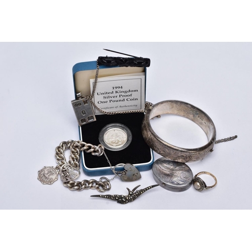 104 - A BAG OF ASSORTED JEWELLERY, to include a silver wide hinged bangle, engraved with a floral design, ... 