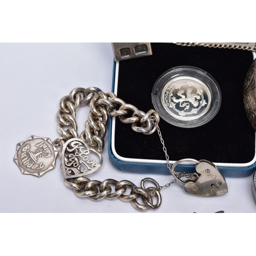 104 - A BAG OF ASSORTED JEWELLERY, to include a silver wide hinged bangle, engraved with a floral design, ... 