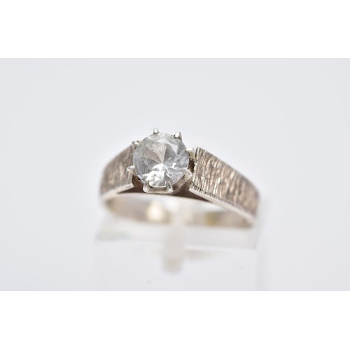 109 - A WHITE METAL SINGLE STONE RING, designed with a claw set, circular cut, colourless stone assessed a... 