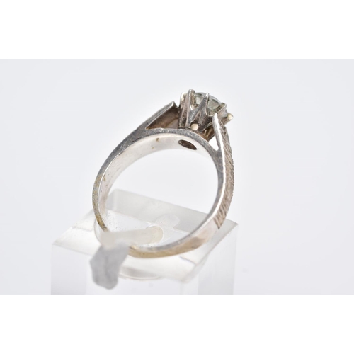 109 - A WHITE METAL SINGLE STONE RING, designed with a claw set, circular cut, colourless stone assessed a... 