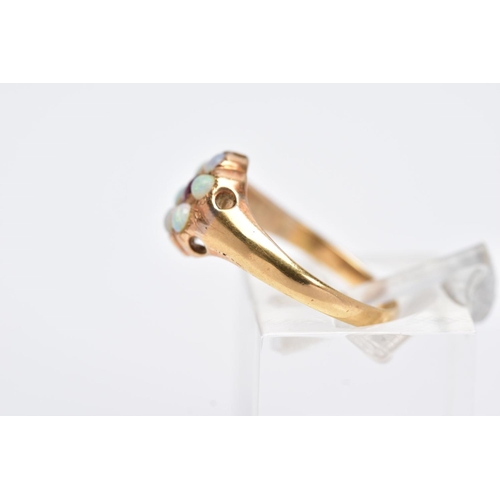 110 - A YELLOW METAL OPAL AND GARNET CLUSTER RING, designed with a central circular cut garnet, within a s... 