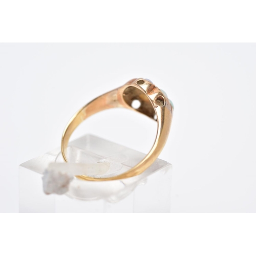 110 - A YELLOW METAL OPAL AND GARNET CLUSTER RING, designed with a central circular cut garnet, within a s... 