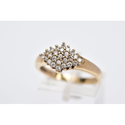 112 - A 9CT GOLD CUBIC ZIRCONIA CLUSTER RING, of a lozenge form, set with circular cut cubic zirconia, pla... 