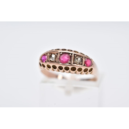 114 - A 9CT GOLD RUBY AND DIAMOND BOAT RING, designed with a row of circular cut rubies interspaced with r... 