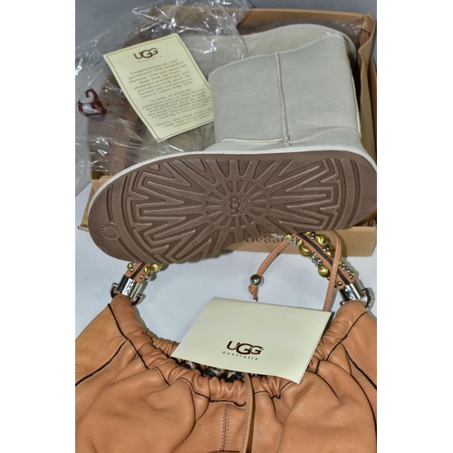 528 - A LADIES LIGHT BROWN LEATHER HANDBAG WITH DECORATIVE HANDLE, together with a boxed pair of ladies pa... 