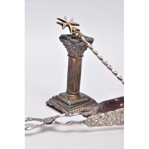 67 - A SILVER CANDLESTICK, A PAIR OF TONGS AND A SPOON, a single column, dwarf candlestick, on a stepped ... 
