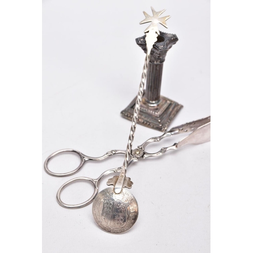 67 - A SILVER CANDLESTICK, A PAIR OF TONGS AND A SPOON, a single column, dwarf candlestick, on a stepped ... 