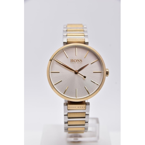 70 - A 'HUGO BOSS' WRISTWATCH, round silver dial signed 'Boss, Hugo Boss', baton markers, gold tone hands... 