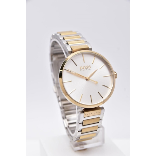 70 - A 'HUGO BOSS' WRISTWATCH, round silver dial signed 'Boss, Hugo Boss', baton markers, gold tone hands... 