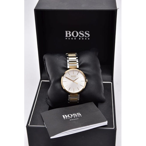 70 - A 'HUGO BOSS' WRISTWATCH, round silver dial signed 'Boss, Hugo Boss', baton markers, gold tone hands... 