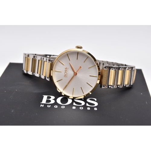 70 - A 'HUGO BOSS' WRISTWATCH, round silver dial signed 'Boss, Hugo Boss', baton markers, gold tone hands... 