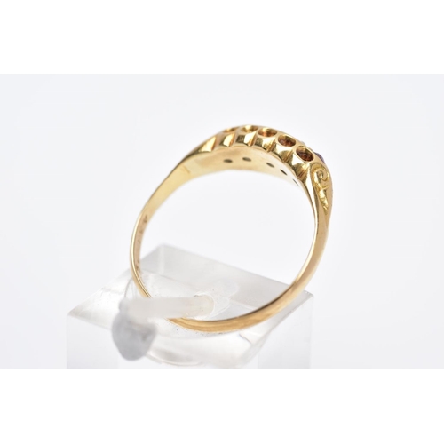 74 - AN EARLY 20TH CENTURY DIAMOND AND RUBY RING, of a boat shape, set with three circular cut rubies, in... 