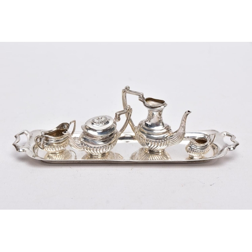 82 - A MINIATURE FIVE PIECE SILVER TEA SET, comprising of teapot with cover, coffee pot missing cover, a ... 