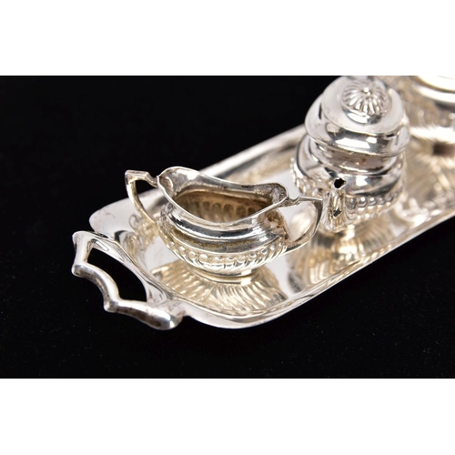 82 - A MINIATURE FIVE PIECE SILVER TEA SET, comprising of teapot with cover, coffee pot missing cover, a ... 