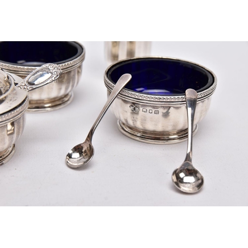 84 - A FIVE PIECE GEORGIAN SILVER CONDIMENTS SETSSET, to include two salts each with a blue glass lining,... 