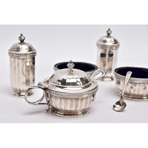 84 - A FIVE PIECE GEORGIAN SILVER CONDIMENTS SETSSET, to include two salts each with a blue glass lining,... 