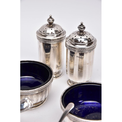 84 - A FIVE PIECE GEORGIAN SILVER CONDIMENTS SETSSET, to include two salts each with a blue glass lining,... 