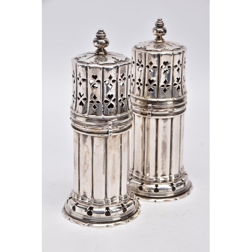 86 - TWO GEORGE V SILVER SUGAR CASTERS, column form, wavy openwork base, pierced cover with a ball finial... 