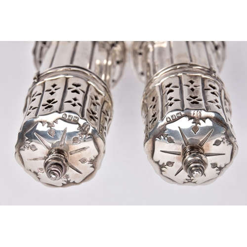86 - TWO GEORGE V SILVER SUGAR CASTERS, column form, wavy openwork base, pierced cover with a ball finial... 