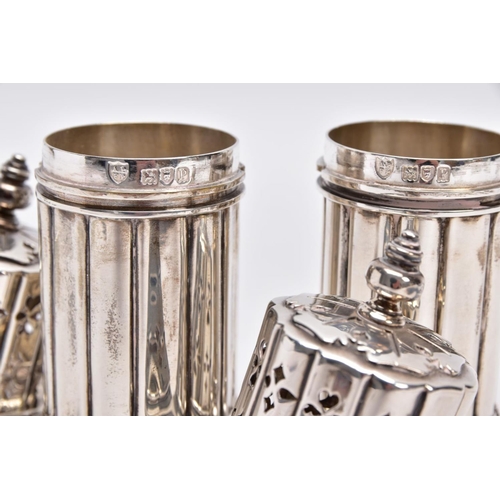 86 - TWO GEORGE V SILVER SUGAR CASTERS, column form, wavy openwork base, pierced cover with a ball finial... 