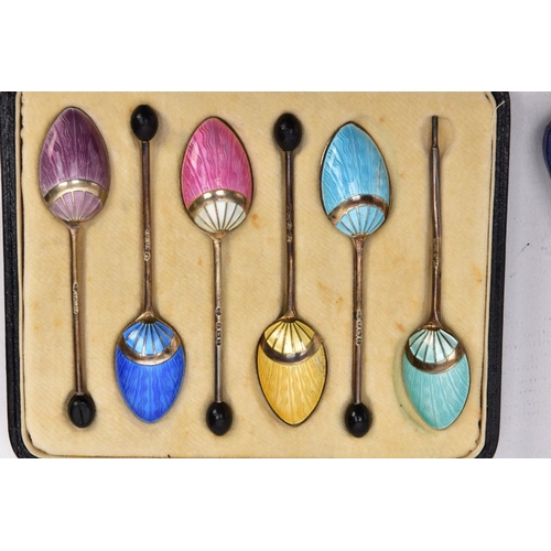 87 - TWO CASED SETS OF SILVER, GUILLOCHE ENAMEL COFFEE AND TEASPOONS, the first a set of six pink guilloc... 