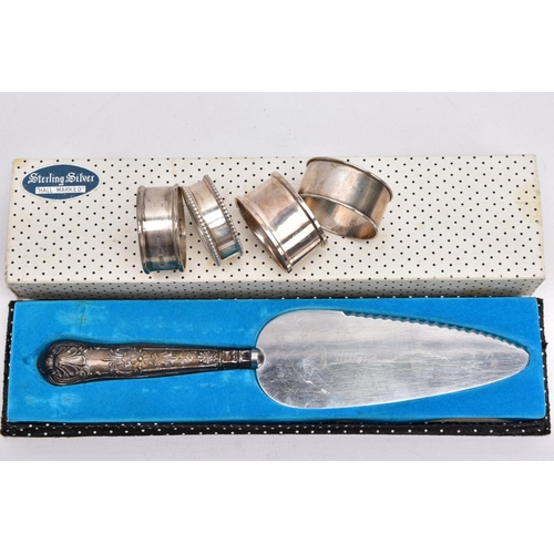 88 - FOUR SILVER NAPKIN RINGS AND A SILVER HANDLED PIE SERVER, to include four modern napkin rings with h... 