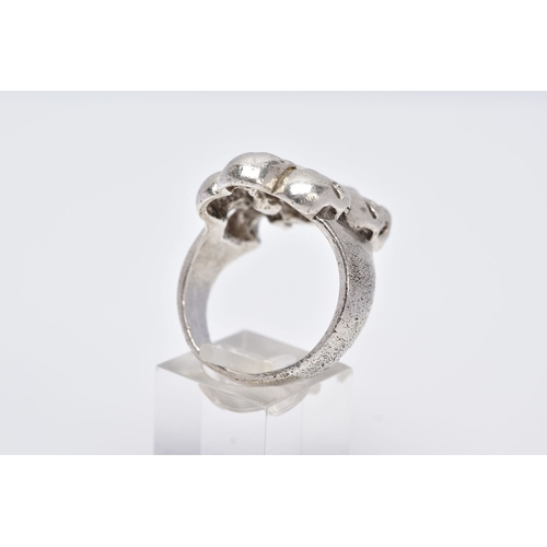 75 - A GENTS SILVER SKULL RING, large ring designed with seven openwork skulls, stamped '925' Birmingham,... 