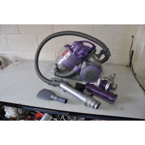 A DYSON TELESCOPE WRAP VACUUM with various attachments (PAT pass and working)