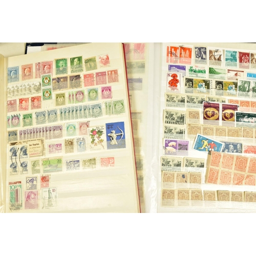 93 - A COLLECTION OF LARGE MINT AND USED STAMPS in twenty three albums, British, Commonwealth and Foreign... 