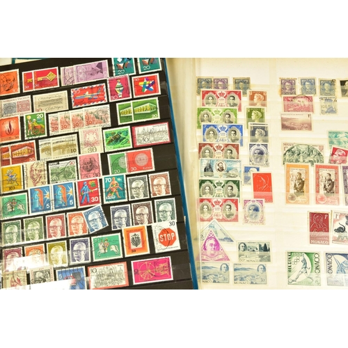 93 - A COLLECTION OF LARGE MINT AND USED STAMPS in twenty three albums, British, Commonwealth and Foreign... 