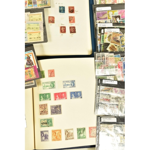 96 - A BOX OF STAMPS HOUSED IN ALBUMS and approximately one hundred and twenty stockcards, two albums con... 