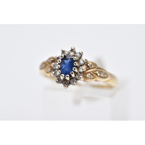 1 - A 9CT GOLD SAPPHIRE AND DIAMOND CLUSTER RING, designed with a central claw set oval cut blue sapphir... 